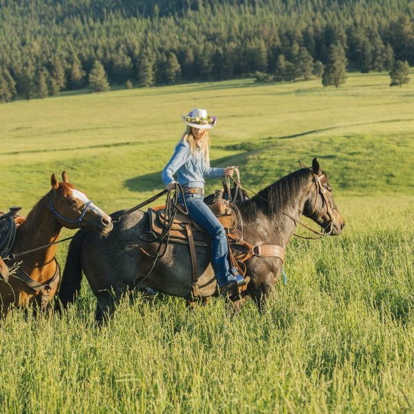 Teenage girl leading four horses, Enterprise, Oregon, United States, North America
